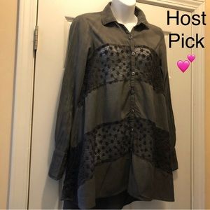 Gray long-sleeve blouse with lace blocking.